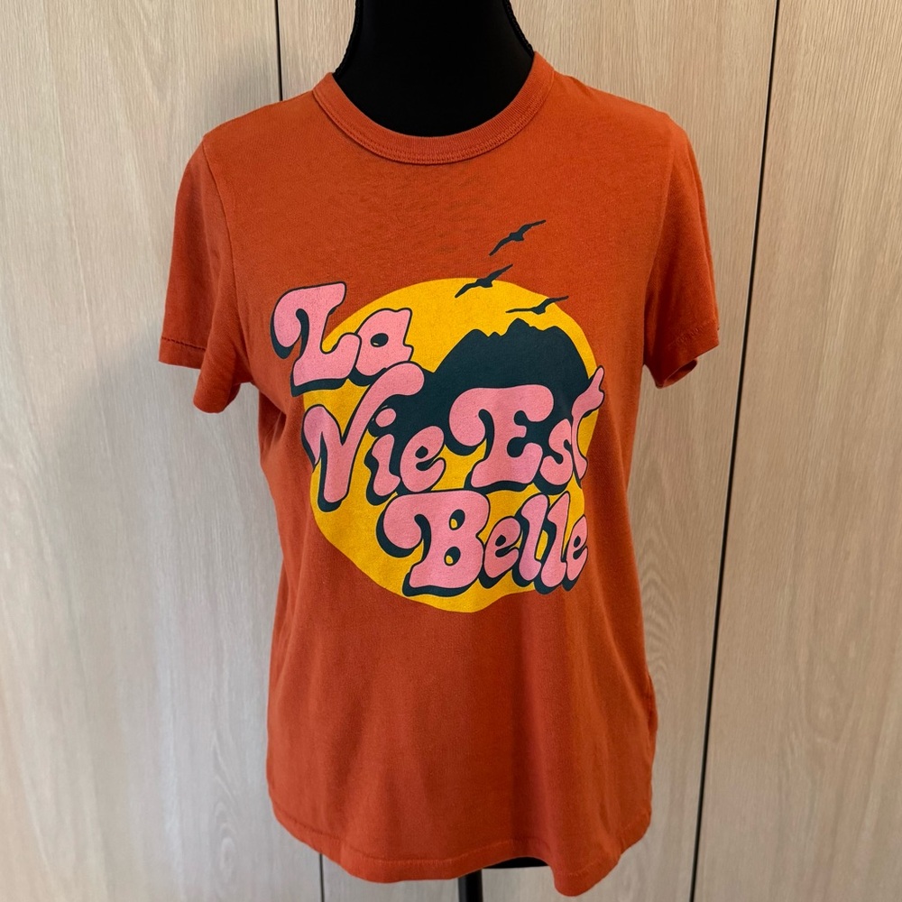 Junk Food Clothing Bright Orange Tee “La Vie Est Belle”